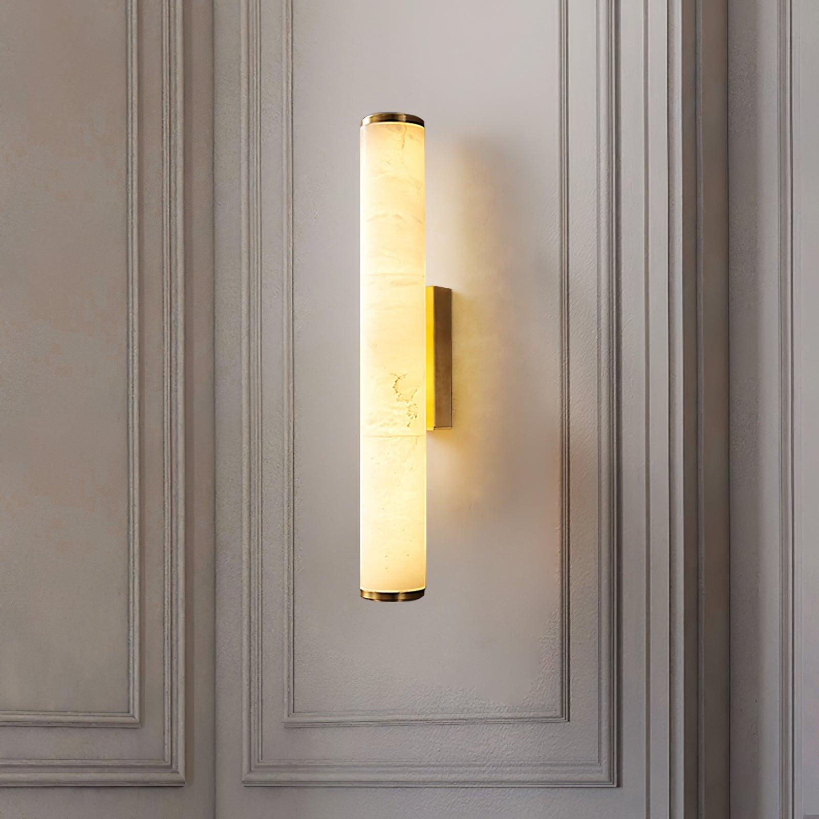Close view of alabaster wall sconce shade and brass mount