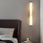 Alabaster wall sconce shade showing soft veined translucency unlit