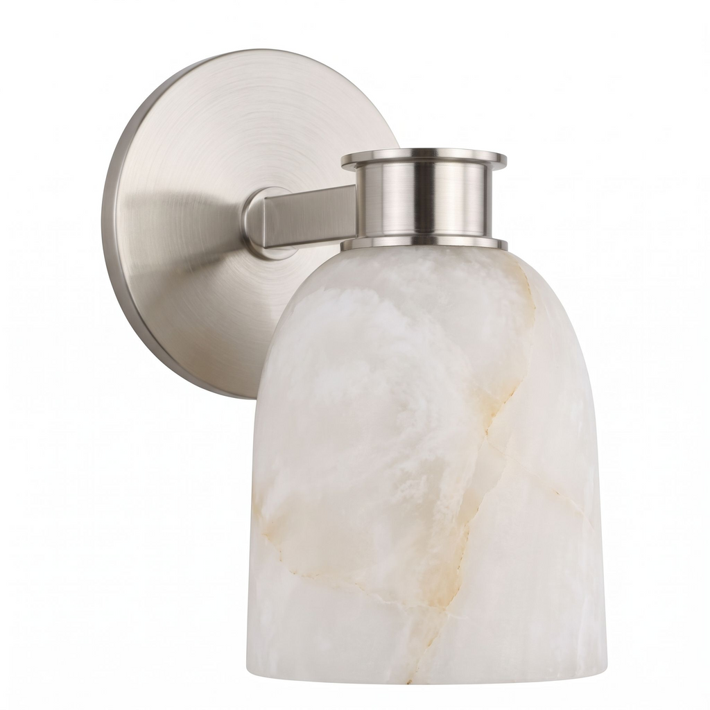 Studio shot of this Clérachic wall sconce in satin nickel finish, its bell-shaped alabaster shade tilting outward.