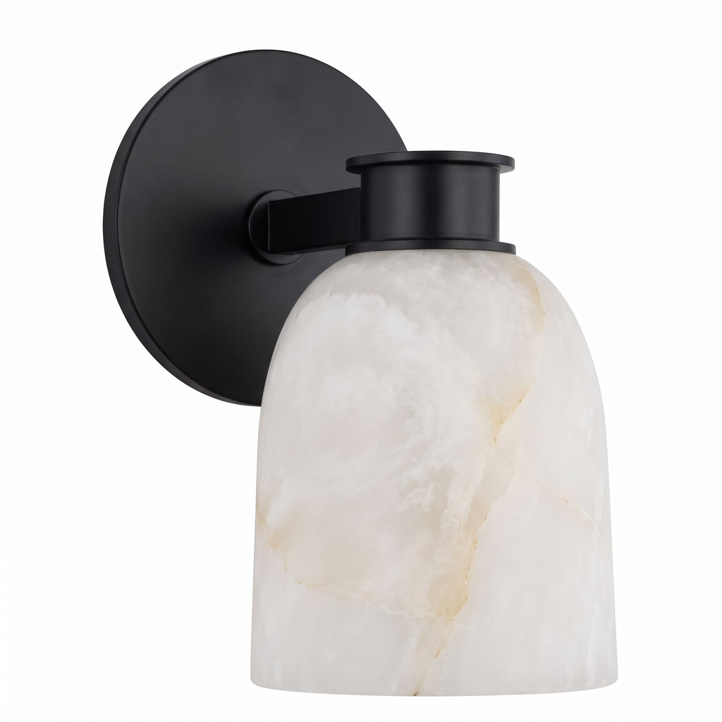 A front view of this Clérachic wall sconce in black finish, its bell-shaped shade angled slightly downward.