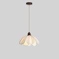 Against a plain grey backdrop, this unlit Clérachic pendant shows its coiled cord and fabric petal shade.