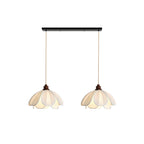 Two shades of this Clérachic pendant hang from a black linear bar, unlit on a plain background.