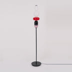 Hand-blown glass floor lamp components lit from within