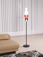 Hand-blown glass floor lamp detail showing unique swirled shapes