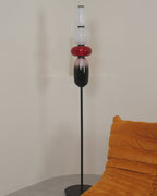 Glowing glass pebble floor lamp in a softly lit interior