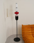 Crystal glass cluster floor lamp lit against a dark backdrop