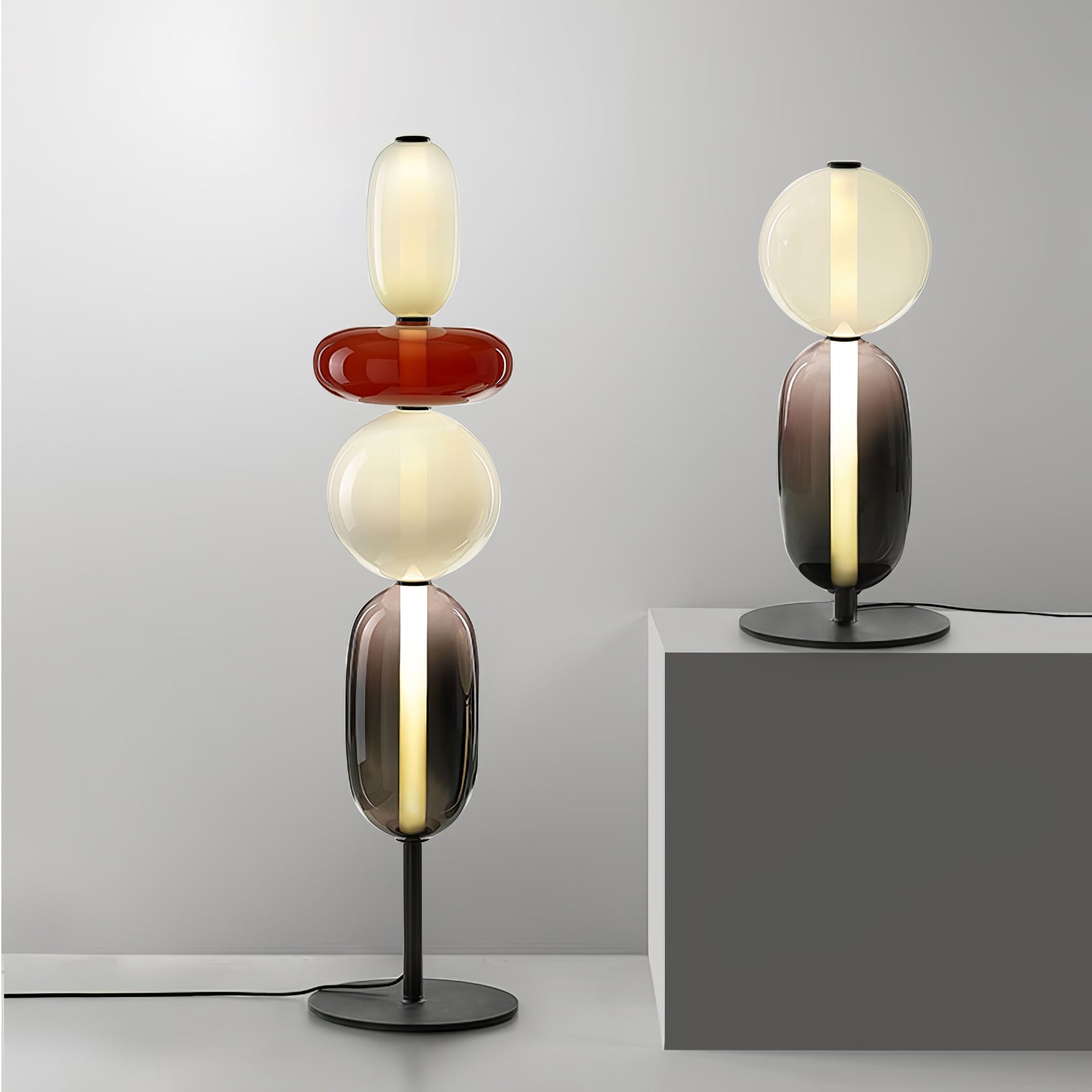 Black-body floor lamp with hand-blown glass clusters near a window