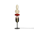 Hand-blown glass cluster floor lamp glowing in a dim living room