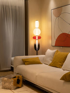 Glass pebble floor lamp glowing warmly in a cozy room