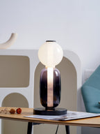 Hand-blown glass table lamp detail with warm glowing pebbles