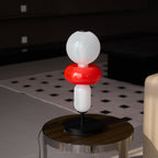 Hand-blown crystal table lamp pebbles catching warm light