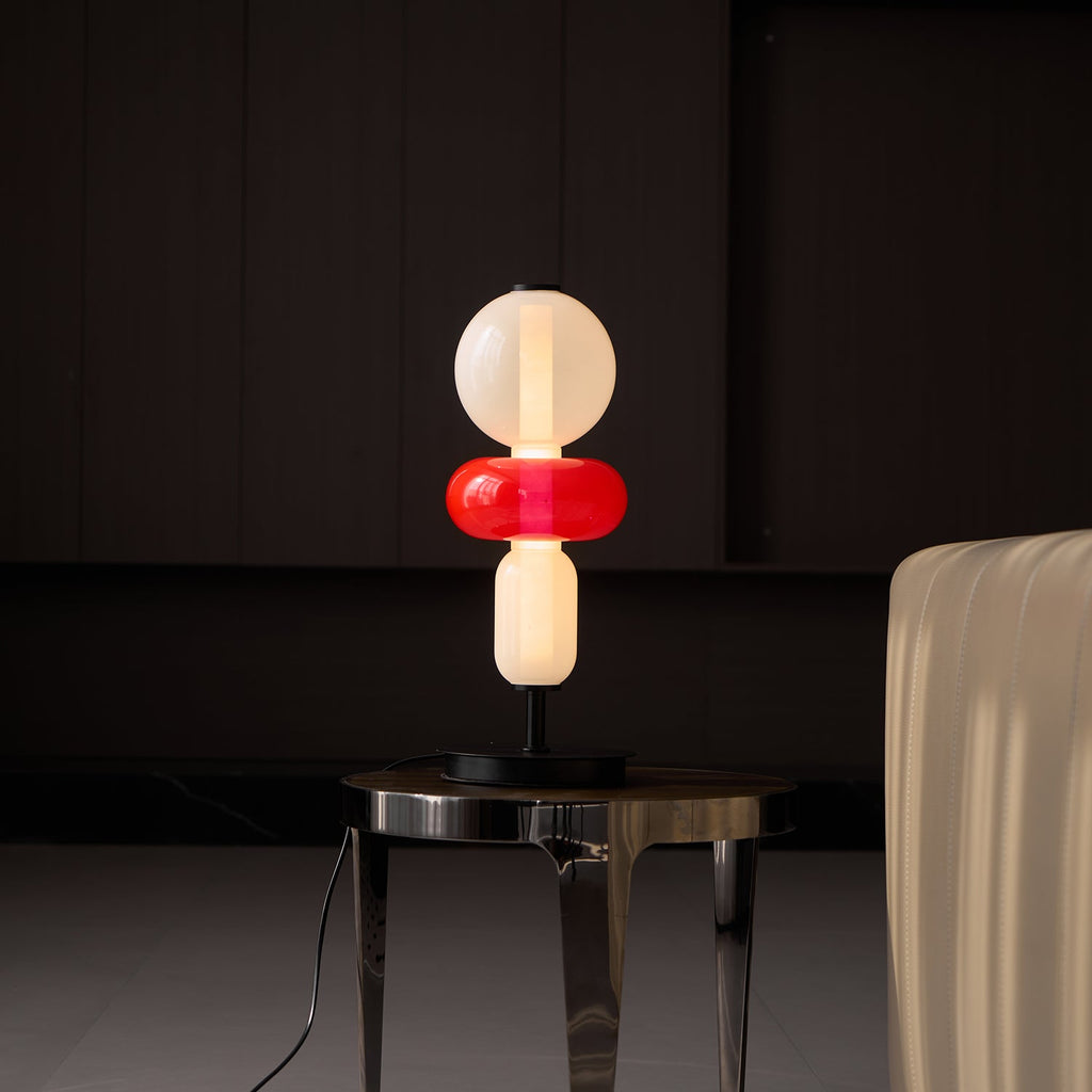 Crystal pebble table lamp glowing softly on a sideboard