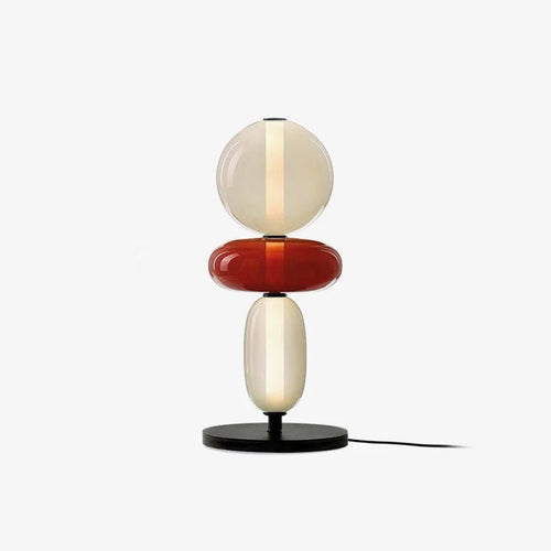 Crystal cluster table lamp with black base lit warmly