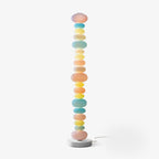 Clérachic multicolour glass globe floor lamp shown unlit on a plain white background, full length with its round base.