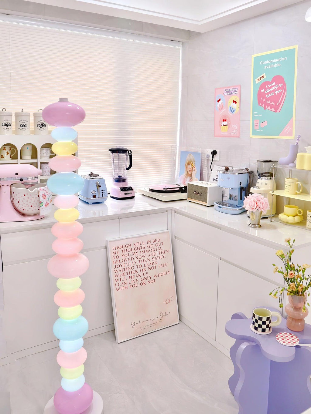 In a kitchen with a pink stand mixer and small appliances, this Clérachic floor lamp's globe column glows near the counter.