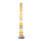Photographed alone on a plain white backdrop with its cord visible, this Clérachic floor lamp shows its full lit column.