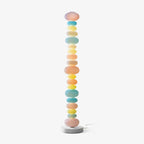 Clérachic multicolour glass globe floor lamp shown unlit on a plain grey background, its power cord coiled at the base.