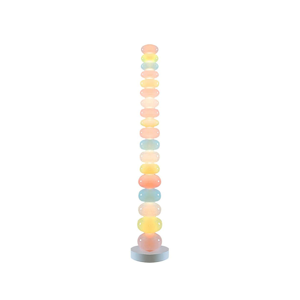 Photographed alone on a plain white backdrop, this Clérachic floor lamp shows its full stack of pastel glass globes lit.