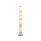 Photographed alone on a plain white backdrop, this Clérachic floor lamp shows its full stack of pastel glass globes lit.