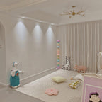 Near a polar bear figure and a floor cushion under recessed lighting, this Clérachic floor lamp's globes glow softly.