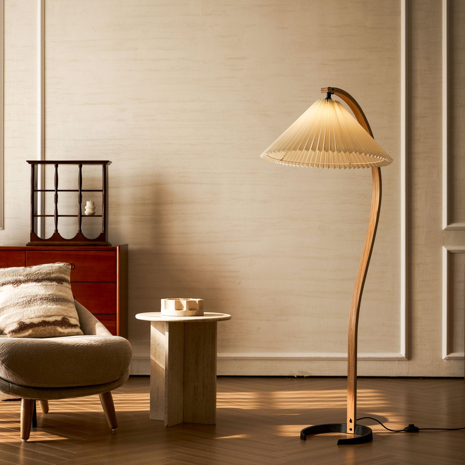 Sculptural floor lamp with linen shade in a bright room corner