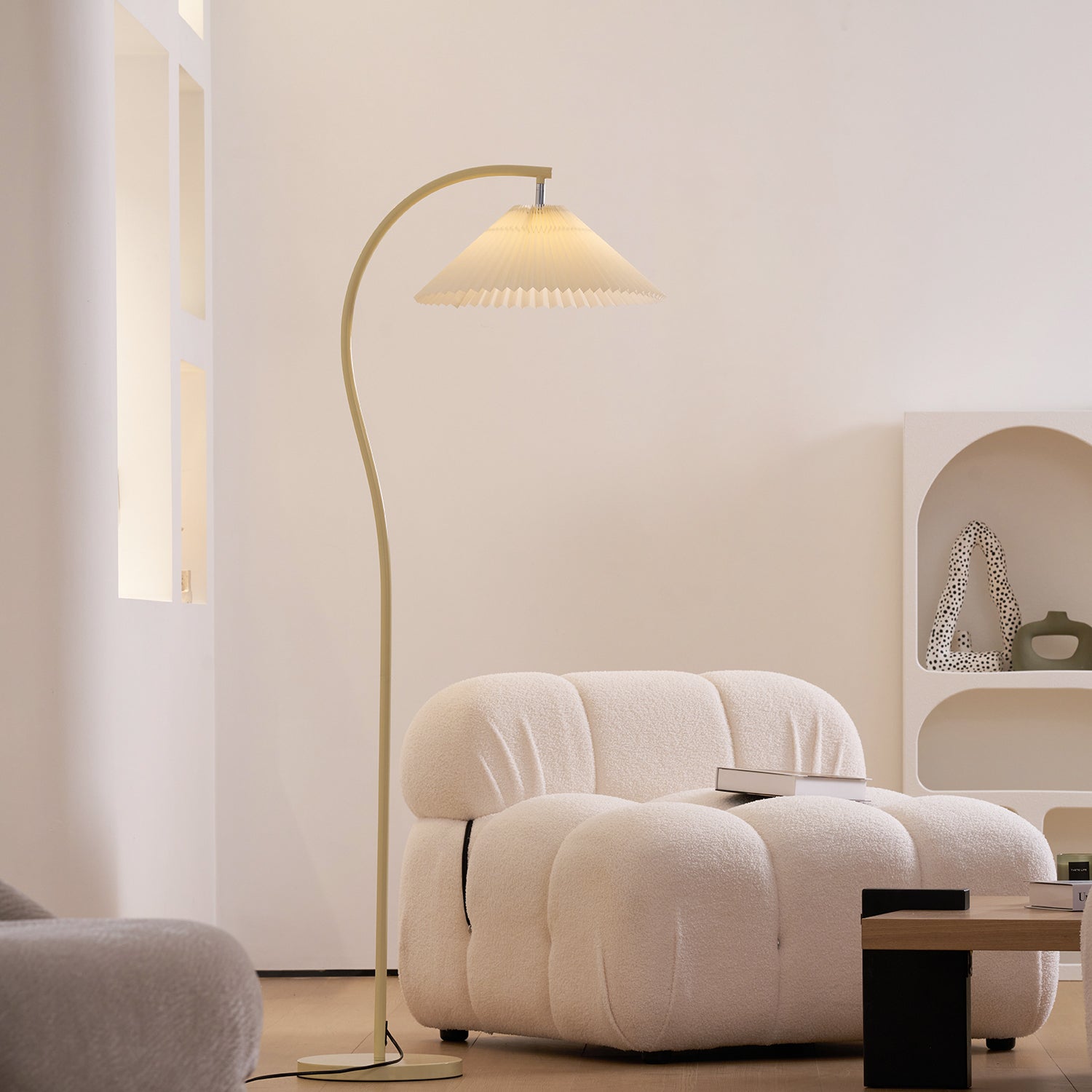 Close view of the pleated linen shade and beech wood frame of the floor lamp