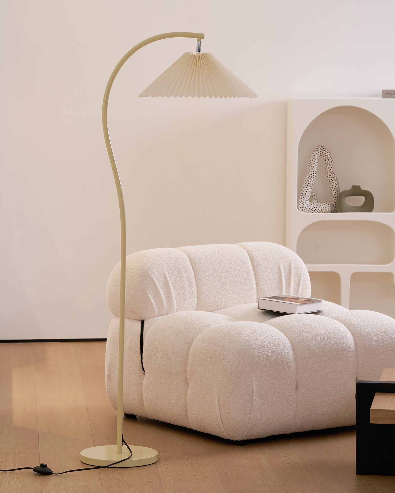 Pleated linen floor lamp in a bright, airy living room