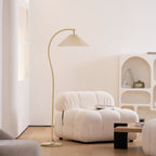 Pleated linen floor lamp adding warm vintage character to a bedroom