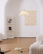Pleated floor lamp casting soft diffused light in a relaxed living space
