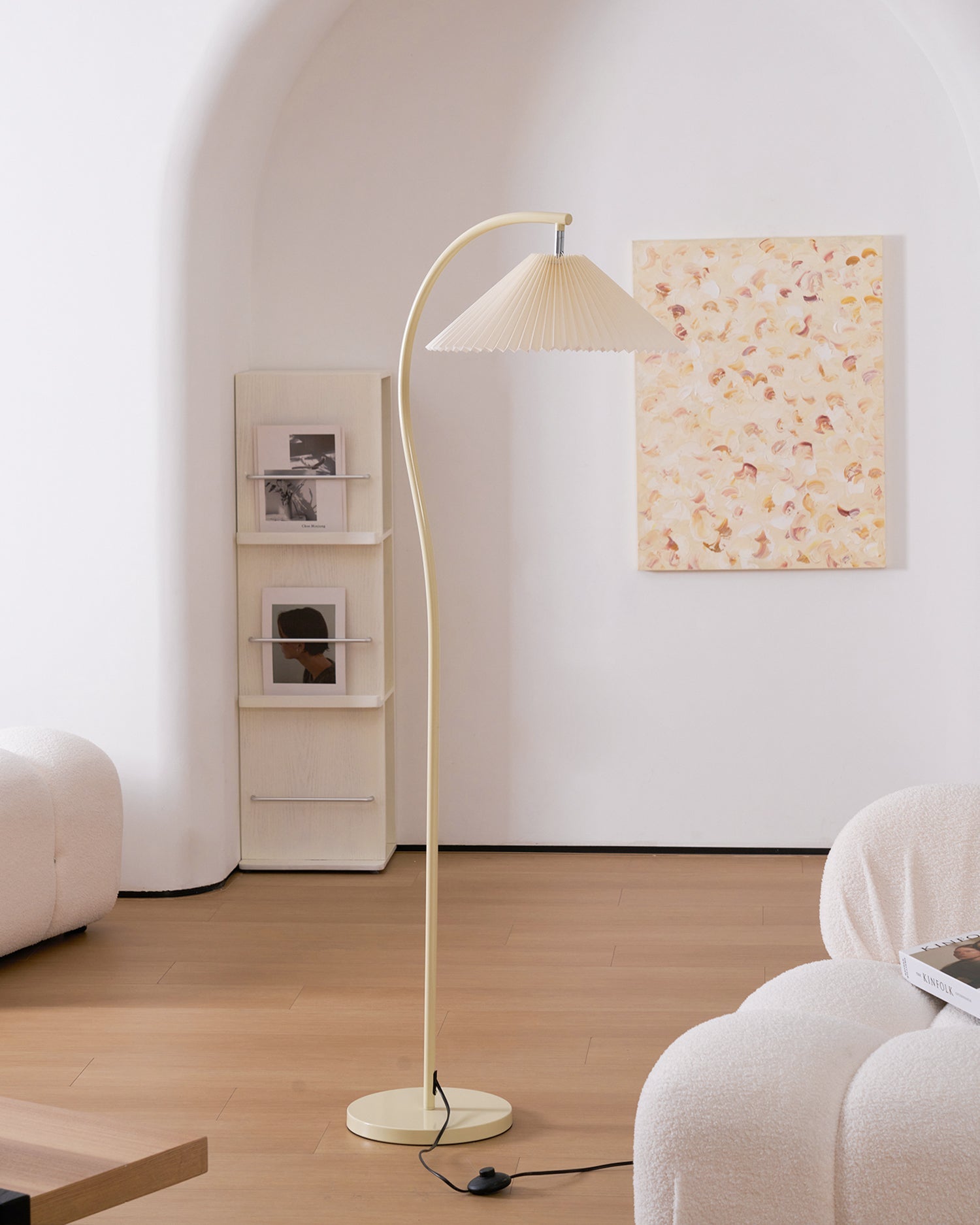 Beech wood and metal frame detail at the base of the pleated floor lamp