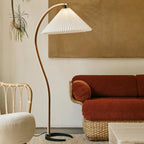 Sculptural floor lamp with iron base and tall beechwood stem