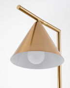 An angled close-up of the Clérachic lamp's cone shade reveals its white interior diffuser and the bulb beneath it.