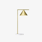 A plain white-background product shot of the Clérachic cone-shade table lamp, angled to show its full brass profile.