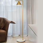 Black-stem floor lamp on a white marble base in a living room