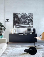 Floor lamp opal cone angled to wash light up a wall