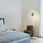 Carrara marble floor lamp glowing softly in an evening room