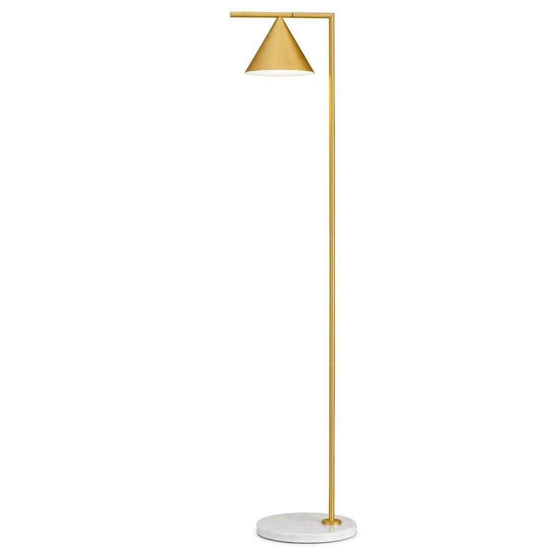 Copper floor lamp with opal cone in a styled living space