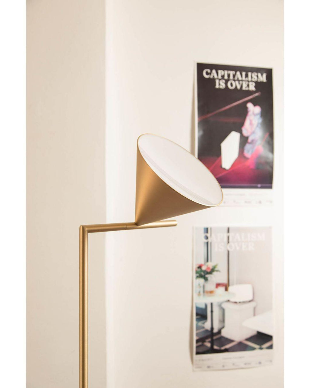 Black floor lamp with opal cone in a minimalist setting