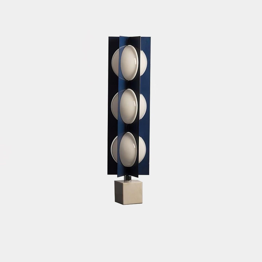 Three-globe Clérachic lamp on a warm stone base, an isolated product shot on a plain grey background.