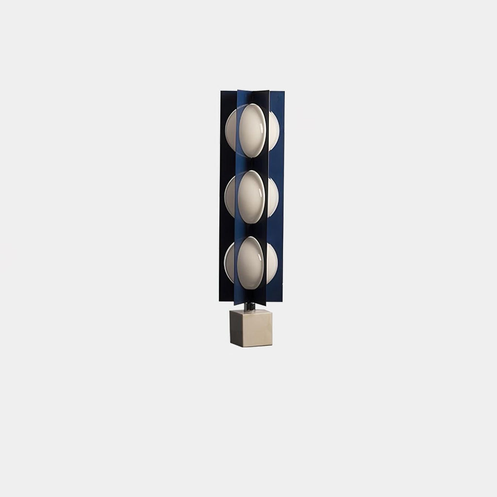 Three-globe Clérachic lamp on a warm stone base, a small isolated product shot on a plain grey background.