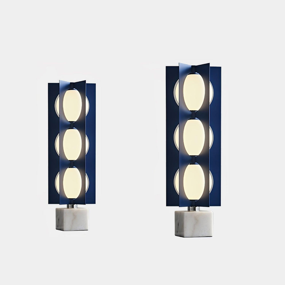 Two Clérachic floor lamps of different heights shown side by side on white marble bases for scale comparison.