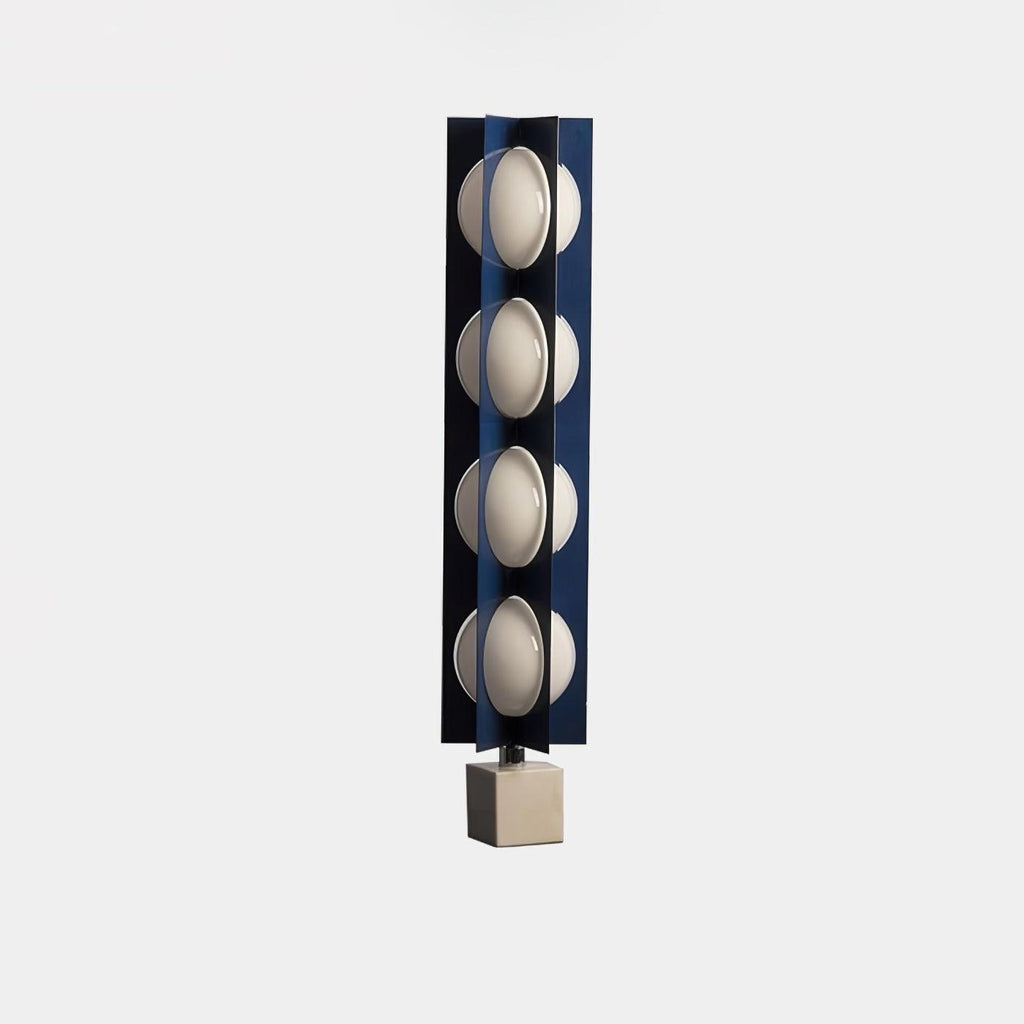 Four-globe Clérachic floor lamp in dark navy on a pale stone base, an isolated product shot on plain white.