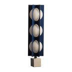Four-globe Clérachic floor lamp in dark navy on a warm stone base, shown unlit against a plain studio background.