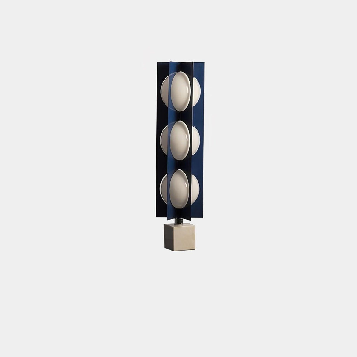 Three-globe Clérachic lamp on a warm stone base, a compact isolated product shot on a plain grey background.