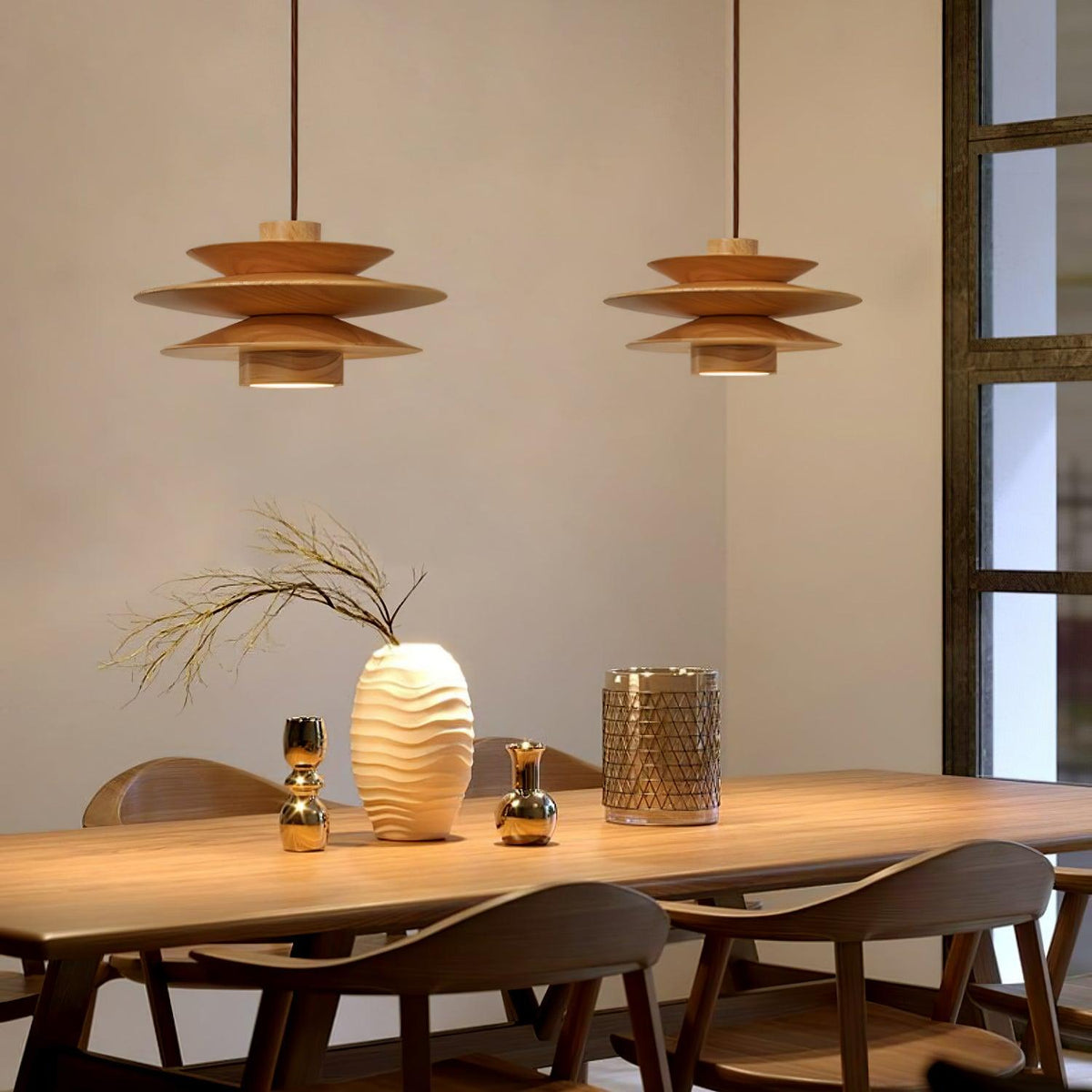 Three of this Clérachic pendant in nature wood line a long dining table set with vases and candle holders near tall windows.