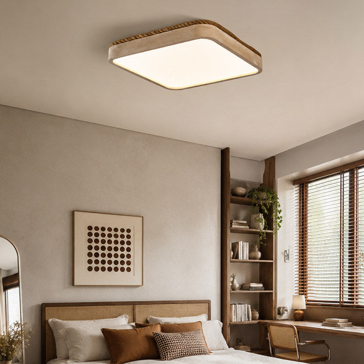 In a corner bedroom with open wood shelving, this Clérachic flush mount light glows above the bed's woven headboard.