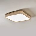 Angled view of this square Clérachic ceiling light in yellow travertine, showing its wound jute rope trim against a grey backdrop.