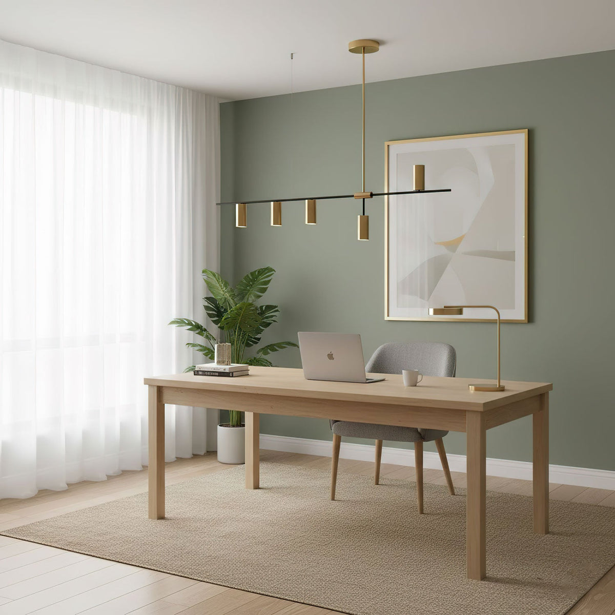 In a home office with sage-green walls, this Clérachic chandelier hangs above a desk and laptop.