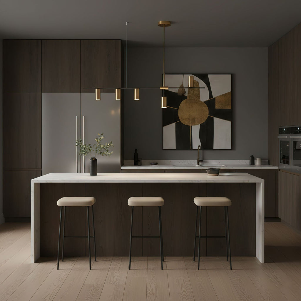 This Clérachic chandelier hangs beside a patterned wall canvas, above a stone kitchen island with cream stools.