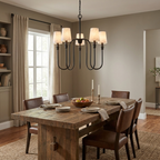 This black Clérachic chandelier hangs above a wood table with leather chairs and a filled bookshelf.